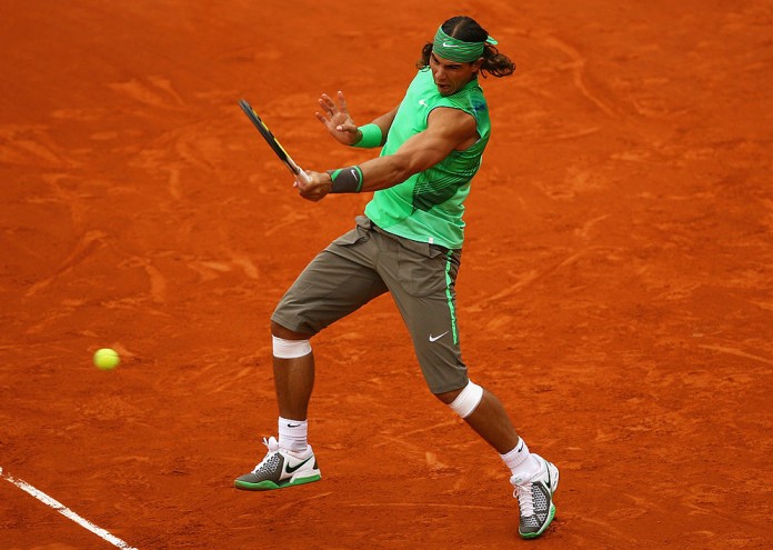 PARIS - JUNE 03: Rafael Nadal of Spain hits a forehand during the Men's Singles Quarter Final match against Nicolas Almagro of Spain on day ten of the French Open at Roland Garros on June 3, 2008 in Paris, France. (Photo by Julian Finney/Getty Images)