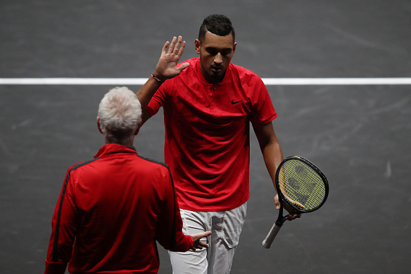 PRAGUE, CZECH REPUBLIC - SEPTEMBER 23: Nick Kyrgios of Team World greets John Mcenroe, Captain of Team World during his singles match against Tomas Berdych of Team Europe on Day 2 of the Laver Cup on September 23, 2017 in Prague, Czech Republic. The Laver Cup consists of six European players competing against their counterparts from the rest of the World. Europe will be captained by Bjorn Borg and John McEnroe will captain the Rest of the World team. The event runs from 22-24 September. (Photo by Julian Finney/Getty Images for Laver Cup)