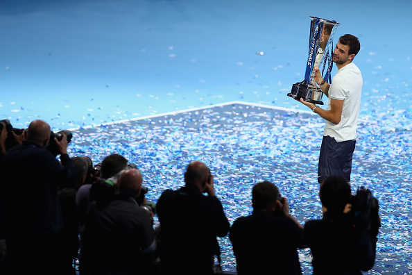 LONDON, ENGLAND - NOVEMBER 19: Grigor Dimitrov of Bulgaria lifts the trophy as he celebrates victory following the mens singles final against David Goffin of Belgium during day eight of the 2017 Nitto ATP World Tour Finals at O2 Arena on November 19, 2017 in London, England. (Photo by Naomi Baker/Getty Images)