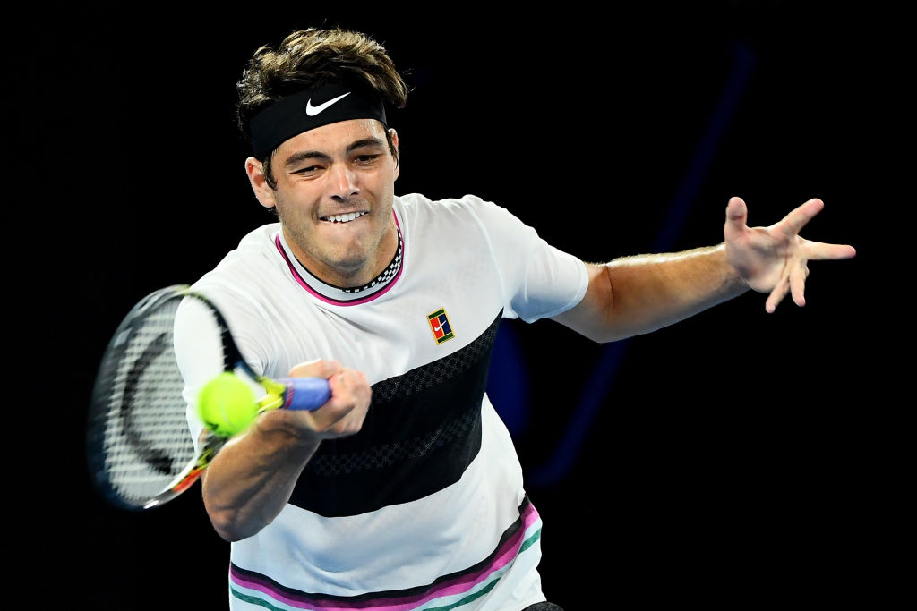 MELBOURNE, AUSTRALIA - JANUARY 18: Taylor Fritz of the United States plays a forehand in his third round match against Roger Federer of Switzerland during day five of the 2019 Australian Open at Melbourne Park on January 18, 2019 in Melbourne, Australia. (Photo by Quinn Rooney/Getty Images)