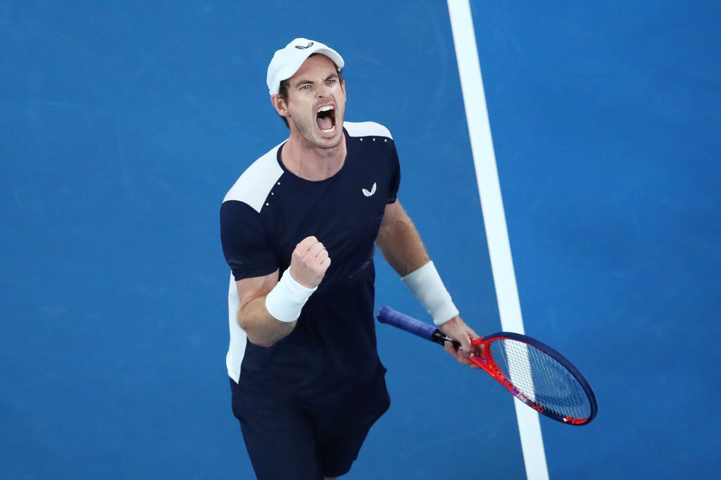 MELBOURNE, AUSTRALIA - JANUARY 14: Andy Murray of Great Britain celebrates winning the third set in his first round match against Roberto Bautista Agut of Spain during day one of the 2019 Australian Open at Melbourne Park on January 14, 2019 in Melbourne, Australia. (Photo by Scott Barbour/Getty Images)