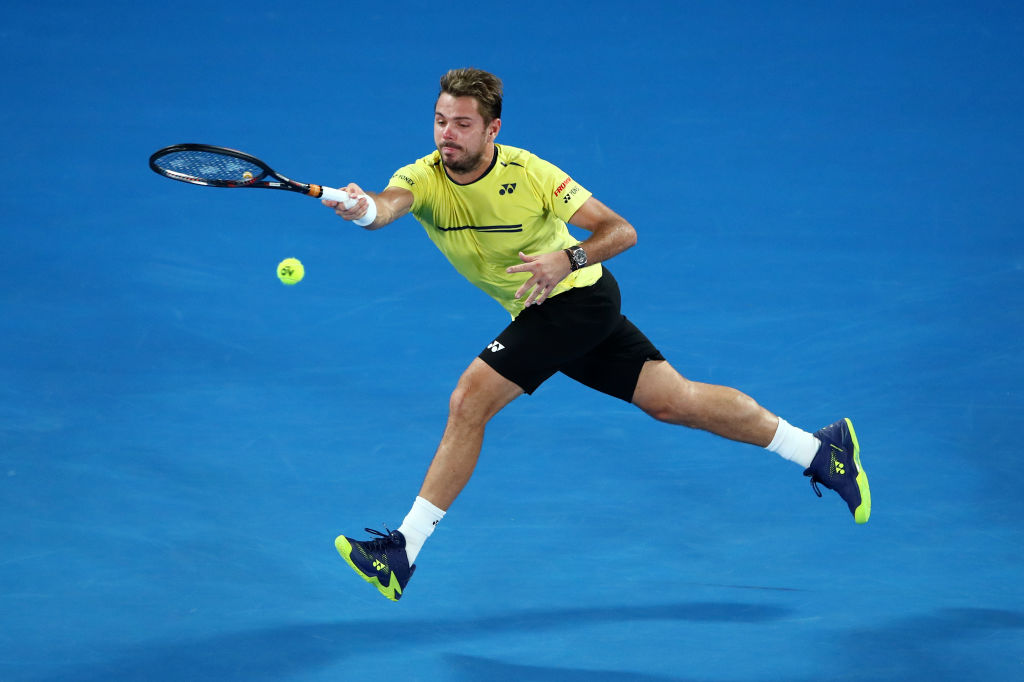 MELBOURNE, AUSTRALIA - JANUARY 17: Stan Wawrinka of Switzerland plays a forehand in his second round match against Milos Raonic of Canada during day four of the 2019 Australian Open at Melbourne Park on January 17, 2019 in Melbourne, Australia. (Photo by Cameron Spencer/Getty Images)
