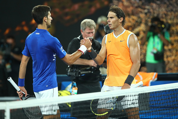 MELBOURNE, AUSTRALIA - JANUARY 27: Novak Djokovic of Serbia embraces Rafael Nadal of Spain following victory in the Men's Singles Final match during day 14 of the 2019 Australian Open at Melbourne Park on January 27, 2019 in Melbourne, Australia. (Photo by Julian Finney/Getty Images)