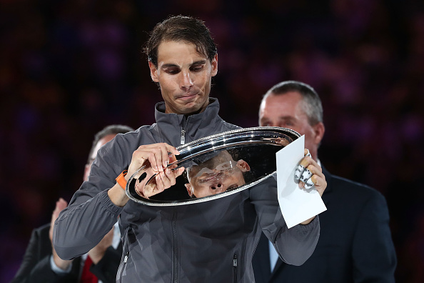 MELBOURNE, AUSTRALIA - JANUARY 27: Rafael Nadal of Spain poses with the runners-up trophy following defeat in his Men's Singles Final match against Novak Djokovic of Serbia during day 14 of the 2019 Australian Open at Melbourne Park on January 27, 2019 in Melbourne, Australia. (Photo by Cameron Spencer/Getty Images)