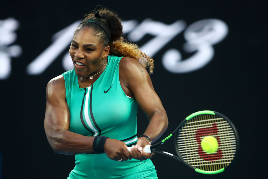 MELBOURNE, AUSTRALIA - JANUARY 21: Serena Williams of the United States plays a backhand in her fourth round match against Simona Halep of Romania during day eight of the 2019 Australian Open at Melbourne Park on January 21, 2019 in Melbourne, Australia. (Photo by Julian Finney/Getty Images)