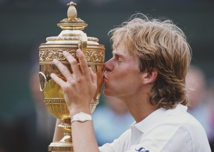 Stefan Edberg of Sweden kisses trophy as he celebrates defeating Boris Becker in the Men's Singles Final of the Wimbledon Lawn Tennis Championship on 4 July 1988 at the All England Lawn Tennis and Croquet Club in Wimbledon, London, England. (Photo by Steve Powell/Getty Images)