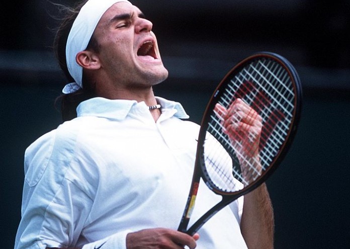 2 Jul 2001: Roger Federer of Switzerland celebrates his victory over Pete Sampras of the USA during the men's fourth round of The All England Lawn Tennis Championship at Wimbledon, London. DIGITAL IMAGE Mandatory Credit: Clive Brunskill/ALLSPORT
