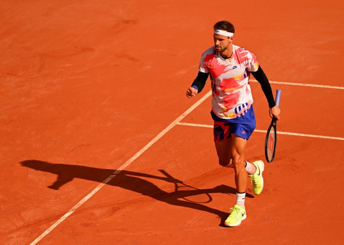 PARIS, FRANCE - OCTOBER 01: Grigor Dimitrov of Bulgaria celebrates after winning a point during his Men's Singles second round match against Andrej Martin of Slovakia on day five of the 2020 French Open at Roland Garros on October 01, 2020 in Paris, France. (Photo by Shaun Botterill/Getty Images)