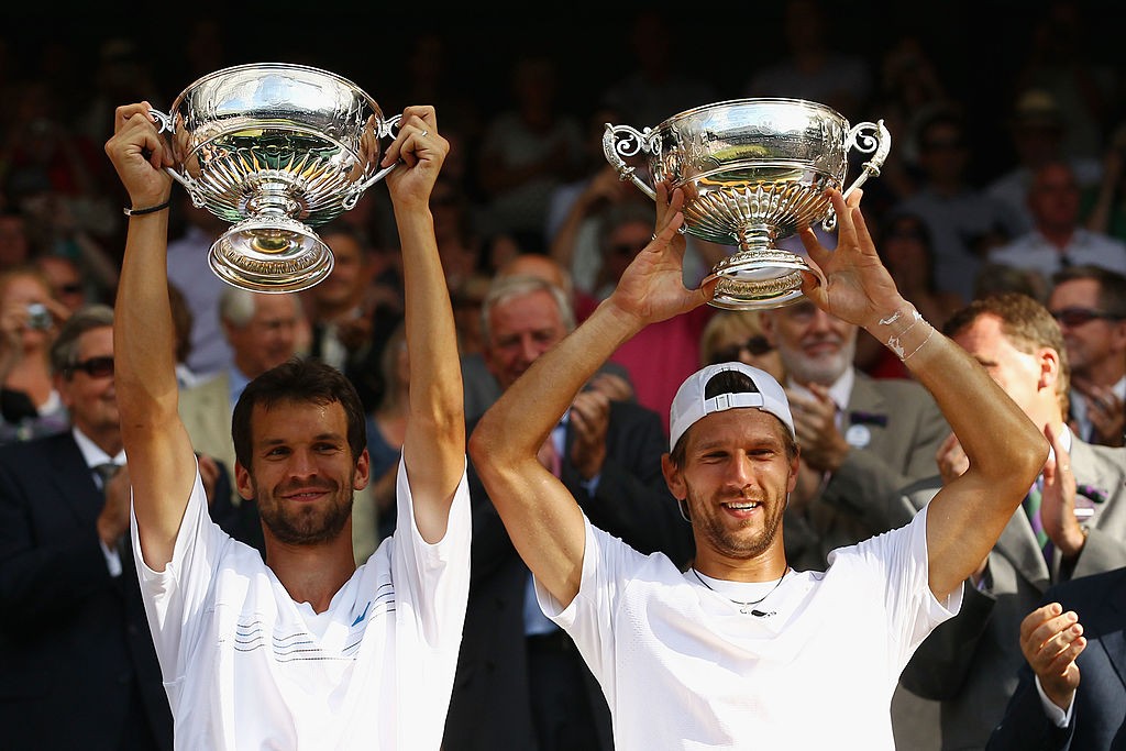 LONDON, ENGLAND - JULY 03: Jurgen Melzer of Austria (R) and Philipp Petzschner of Germany celebrate after winning the Mens Doubles Final against Robert Lindstedt of Sweden and Horia Tecau of Romania on Day Twelve of the Wimbledon Lawn Tennis Championships at the All England Lawn Tennis and Croquet Club on July 3, 2010 in London, England. (Photo by Julian Finney/Getty Images)