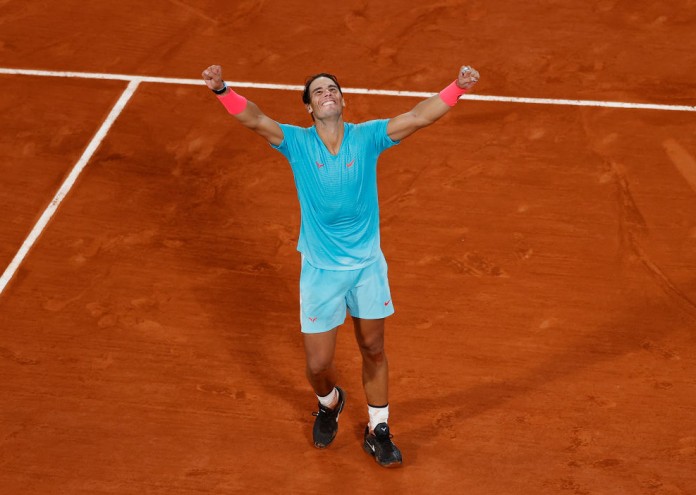 PARIS, FRANCE - OCTOBER 11: Rafael Nadal of Spain celebrates after winning championship point during his Men's Singles Final against Novak Djokovic of Serbia on day fifteen of the 2020 French Open at Roland Garros on October 11, 2020 in Paris, France. (Photo by Clive Brunskill/Getty Images)