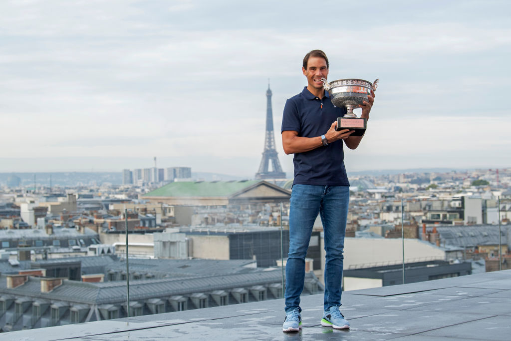 PARIS, FRANCE - OCTOBER 12: Rafael Nadal of Spain poses on the roof of Les Galeries Lafayette with Les Mousquetaires trophy following his victory in the Men's Singles Finals against Novak Djokovic of Serbia on day fifteen of the 2020 French Open on October 12, 2020 in Paris, France. Rafael Nadal won his 13th trophy. (Photo by Aurelien Meunier/Getty Images)