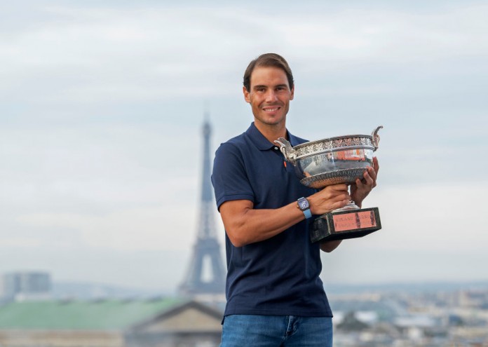 PARIS, FRANCE - OCTOBER 12: Rafael Nadal of Spain poses on the roof of Les Galeries Lafayette with Les Mousquetaires trophy following his victory in the Men's Singles Finals against Novak Djokovic of Serbia on day fifteen of the 2020 French Open on October 12, 2020 in Paris, France. Rafael Nadal won his 13th trophy. (Photo by Aurelien Meunier/Getty Images)