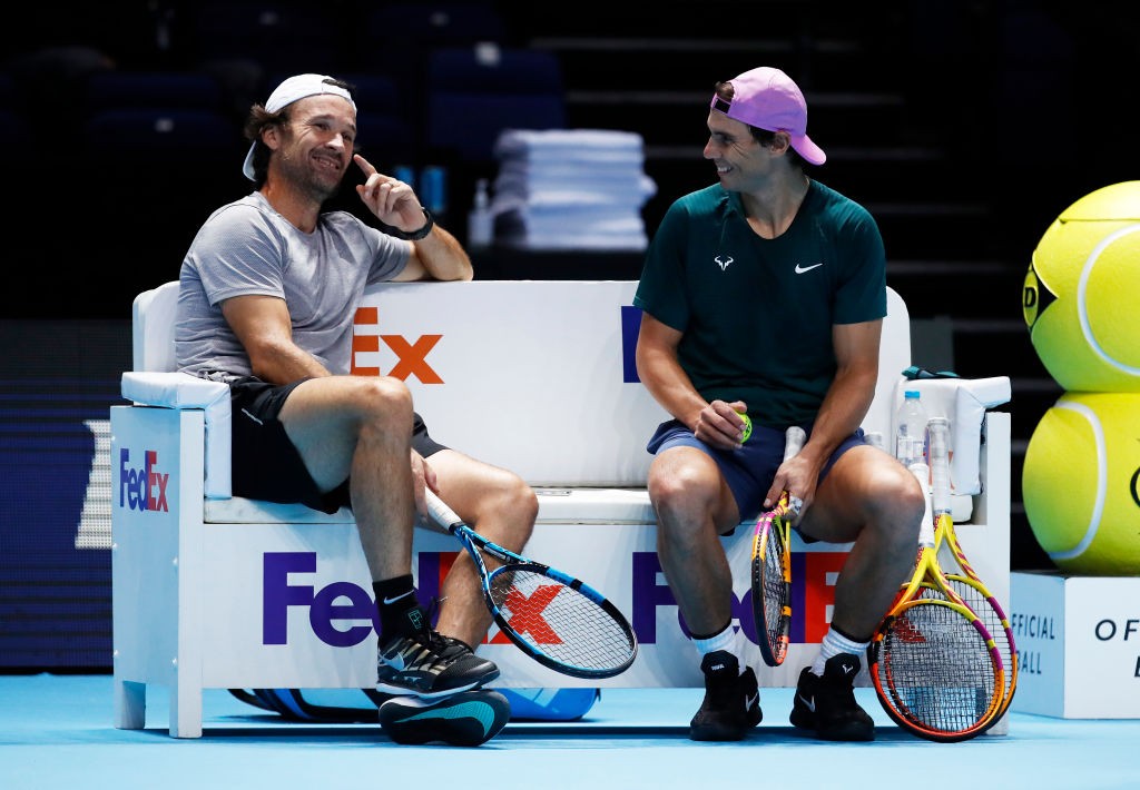 LONDON, ENGLAND - NOVEMBER 14: Rafael Nadal of Spain in good spirits with his coach Carlos Moya as he takes a break during a training session prior to the Nitto ATP World Tour Finals at O2 Arena on on November 14, 2020 in London, England. (Photo by Clive Brunskill/Getty Images)