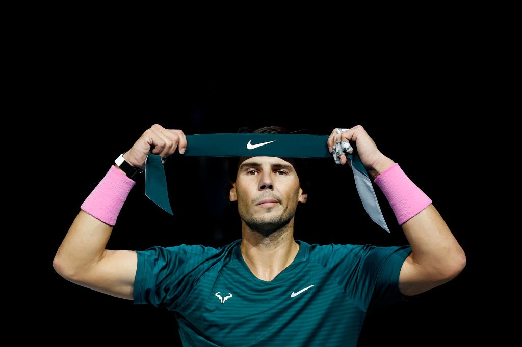 LONDON, ENGLAND - NOVEMBER 19: Rafael Nadal of Spain adjusts his headband during his match against Stefanos Tsitsipas of Greece during their third round robin match on Day Five of the Nitto ATP World Tour Finals at The O2 Arena on November 19, 2020 in London, England. (Photo by Clive Brunskill/Getty Images)