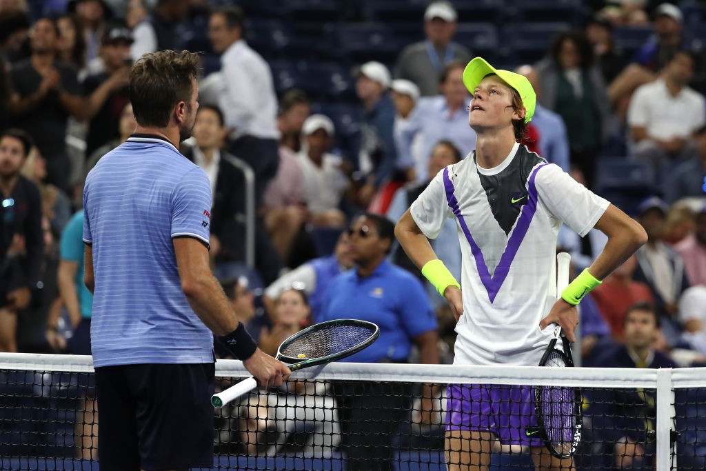 NEW YORK, NEW YORK - AUGUST 26: Stan Wawrinka of Switzerland shakes hands with Jannik Sinner of Italy after their Men's Singles first round match during day one of the 2019 US Open at the USTA Billie Jean King National Tennis Center on August 26, 2019 in the Flushing neighborhood of the Queens borough of New York City. (Photo by Mike Stobe/Getty Images for USTA)