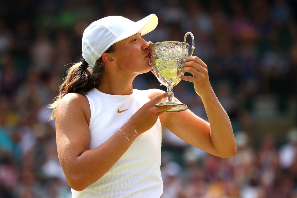 LONDON, ENGLAND - JULY 14: Winner Iga Swiatek of Poland kisses her trophy after the Girls' Singles final on day twelve of the Wimbledon Lawn Tennis Championships at All England Lawn Tennis and Croquet Club on July 14, 2018 in London, England. (Photo by Matthew Stockman/Getty Images)
