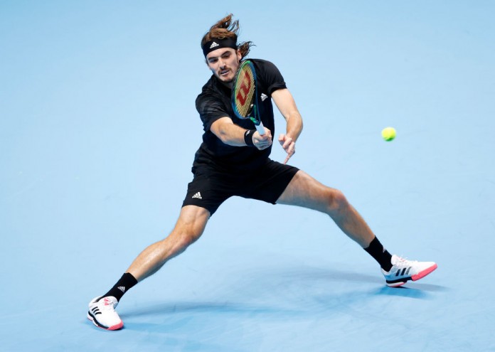 LONDON, ENGLAND - NOVEMBER 15: Stefanos Tsitsipas of Greece in action during his round robin match against Dominic Thiem of Austria during their first round robin match on Day one of the Nitto ATP World Tour Finals at The O2 Arena on November 15, 2020 in London, England. (Photo by Clive Brunskill/Getty Images)
