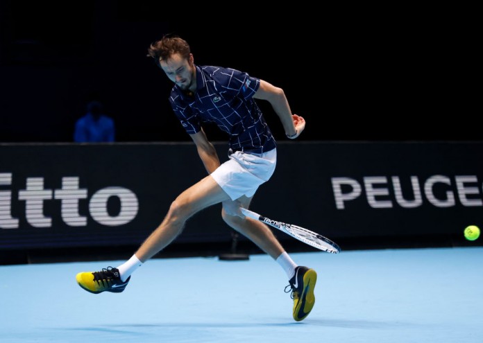 LONDON, ENGLAND - NOVEMBER 20: Daniil Medvedev of Russia serves plays a 'tweener' through the legs shot during his singles match against Diego Schwartzman of Argentina during day six of the Nitto ATP World Tour Finals at The O2 Arena on November 20, 2020 in London, England. (Photo by Clive Brunskill/Getty Images)