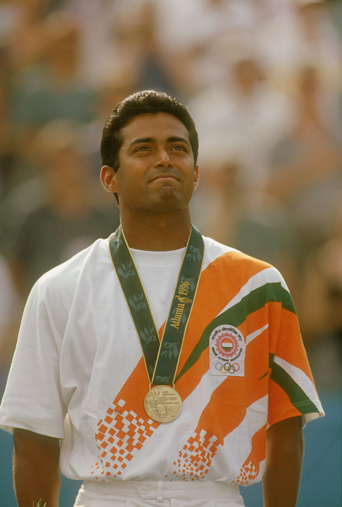 ATLANTA, USA - AUGUST 4: Leander Paes of India stands on the podium after winning a bronze medal in the men's singles tennis event at the 1996 Summer Olympic Games in Atlanta, Georgia on August 3, 1996. (Photo by Gary M. Prior/ Getty Images)