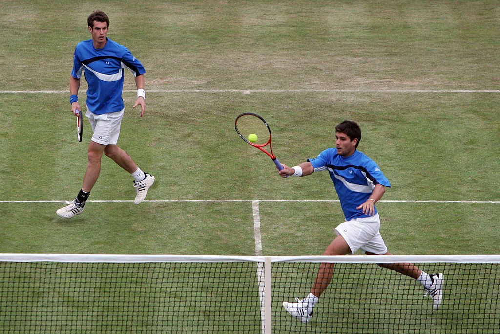 LONDON - JUNE 11: Andy Murray of Great Britain and Daniel Vallverdu of Venezuela in action during their double match against Jonas Bjorkman of Sweden and Kevin Ullyett of Zimbabweon Day 3 of the Artois Championships at Queen's Club on June 11, 2008 in London, England. (Photo by Christopher Lee/Getty Images)