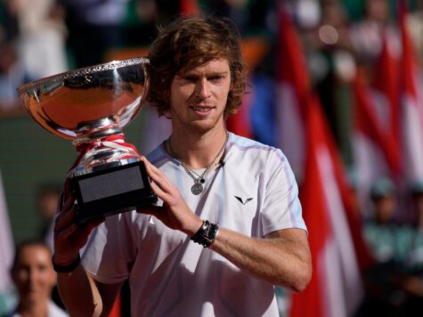 Andrey Rublev, of Russia, poses with his trophy after defeating Holger Rune, of Denmark, 5/7, 6/2, 7/5 in the Monte Carlo Tennis Masters final match in Monaco, Sunday, April 16, 2023. (AP Photo/Daniel Cole)